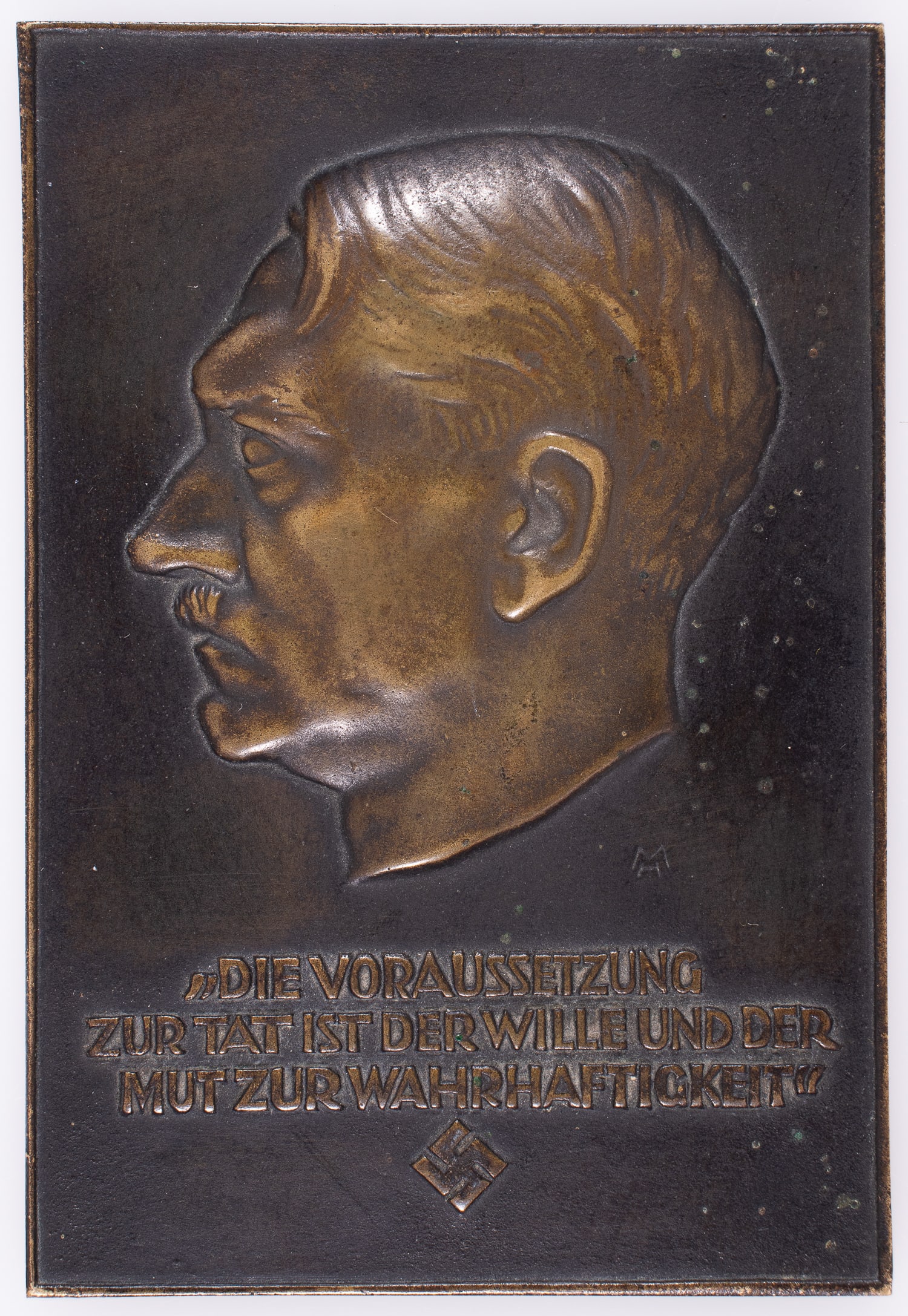 ADOLF HITLER BRONZE WALL PLAQUE RELIEF: WWII Adolf Hitler bronze wall plaque relief. The front features Hitler's face turned right and reads 'Die Voraussetzung zur Tat ist der Wille und der Mut zur Wahrhaftigkeit.' Also features a stamped