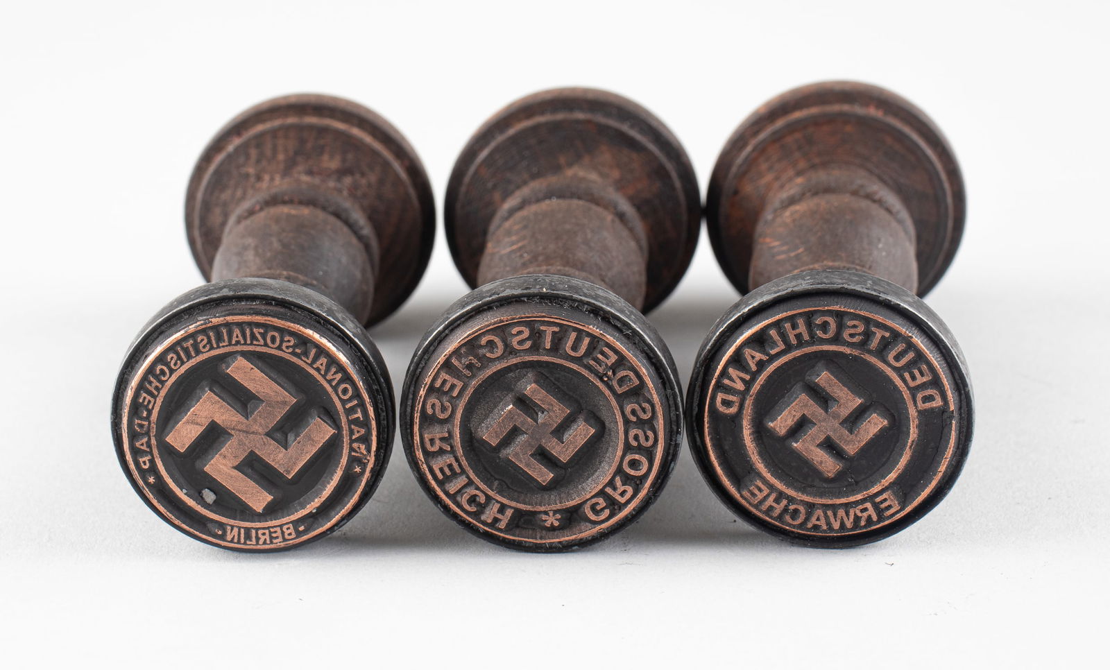 3 WWII NAZI HANDSTAMPS: Three WWII Nazi wooden handstamps, each with a swastika in the center, one reads 'Deutschland Erwache,' one reads 'Gross Deutsches Reich,' and one reads 'National-Sozialistische-D.A.P. Berlin,' crack