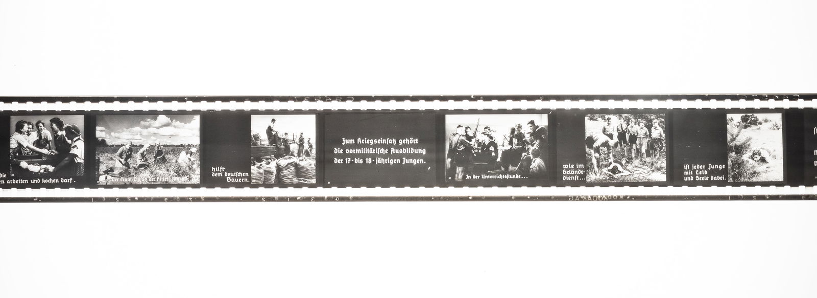 WWII GERMAN HITLER YOUTH WAR EFFORT PROPAGANDA EDUCATIONAL FILM REEL: WWII German Hitler Youth war effort propaganda 'educational' teaching film, 'illustrated book for training in the Hitler Youth,' 35mm b/w slide reel, titled 'Hitler Youth's War Effort,' by Lipropa,