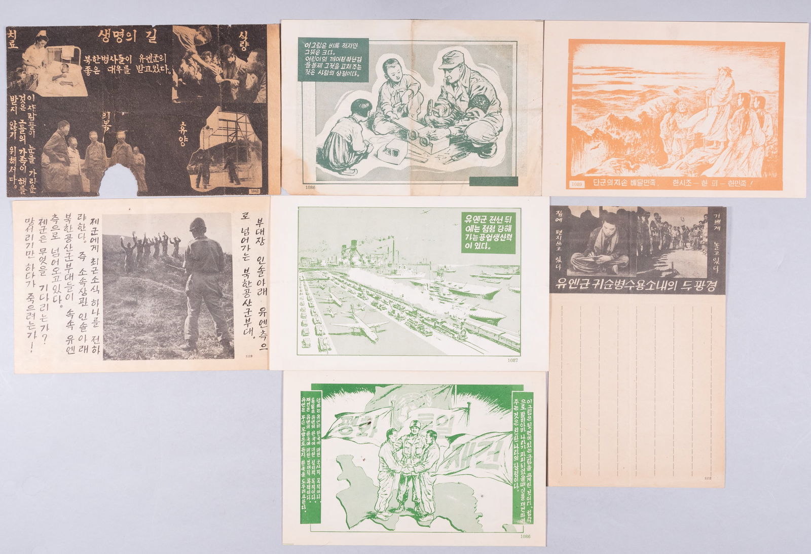 7 KOREAN WAR PROPAGANDA LEAFLETS: Seven Korean War propaganda leaflets, which would be used on North Korean combatants. Including 'Peace is the U.N.'s Mission,' no. 1086, 'The U.N. is Getting Stronger, no. 1087, 'Will Fix a Child's To