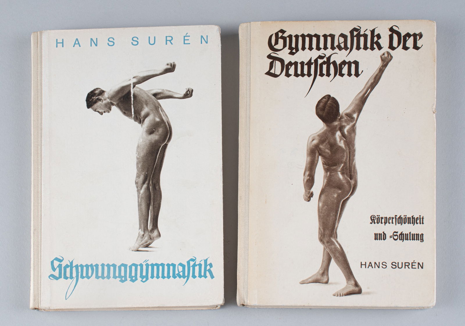 2 HANS SUREN GERMAN NATURIST NUDIST BOOKS: 'Gymnastic der Deutschen' (German Gymnastics) by HANS SUREN (1885 - 1972), a German officer, author, and champion of Naturism. With an advertisement for the book, fold-out exercise sheets, and an