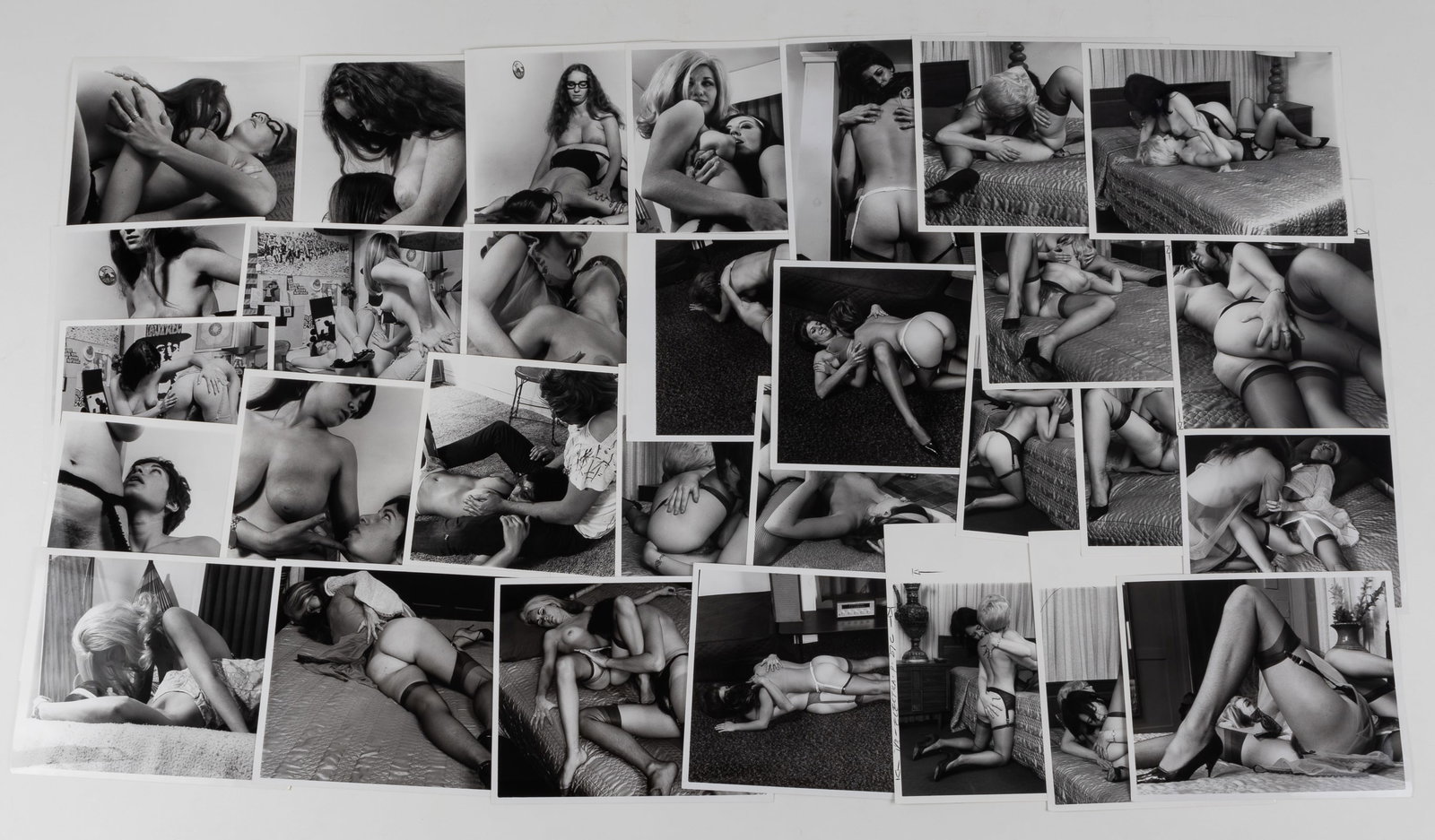 30 VINTAGE ADULT EROTIC LESBIAN PHOTOGRAPHS: Thirty vintage b/w adult lesbian erotic photographs, all from professional scenes, likely intended for magazine publishing, all with performer names on the reverse, two with crop marks and instruction