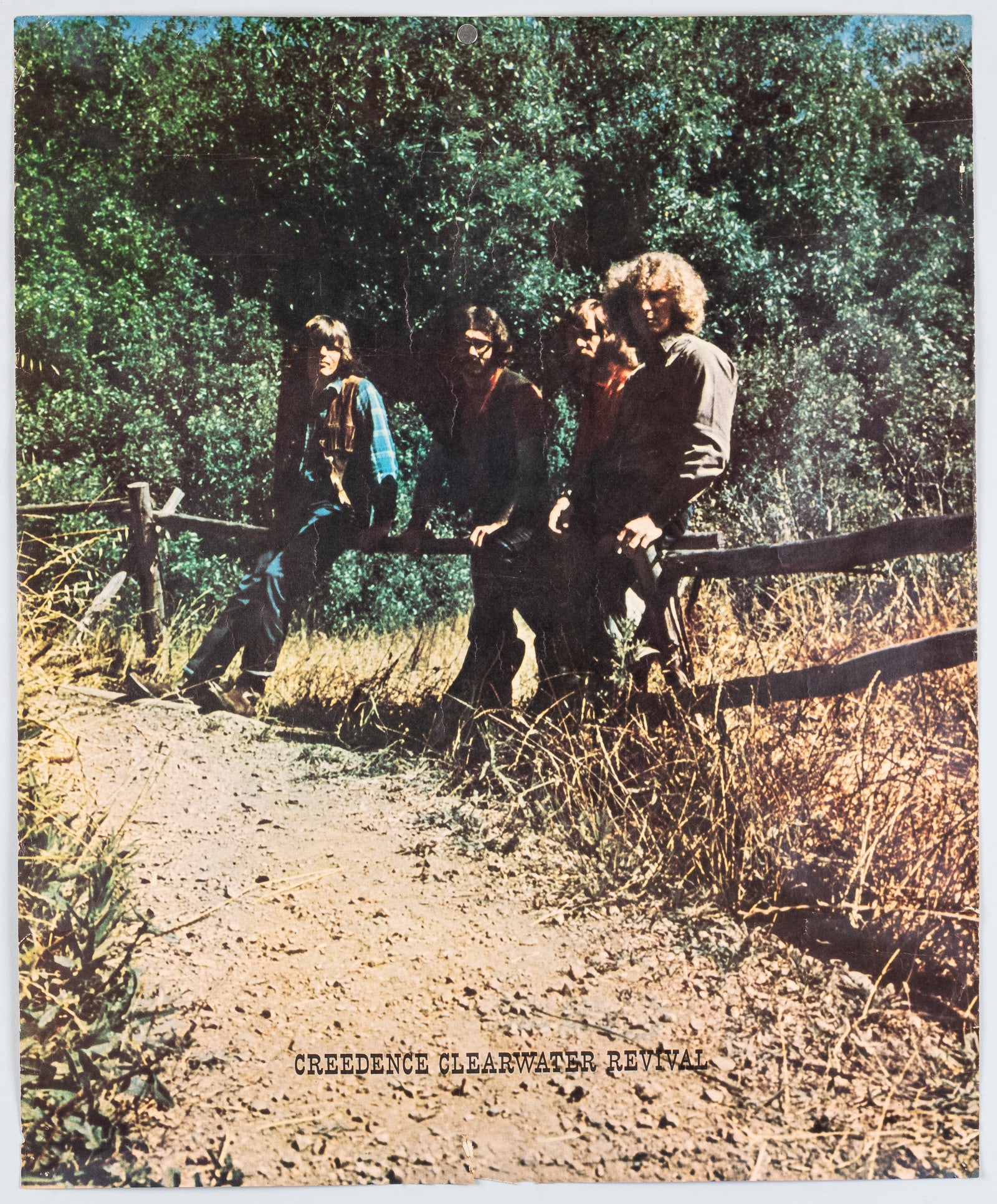 CREEDENCE CLEARWATER REVIVAL GREEN RIVER 1969 POSTER: Creedence Clearwater Revival Green River 1969 album poster. Small tear bottom edge, surface creases, corner pinholes. Ships rolled. 22 x 27 inches.