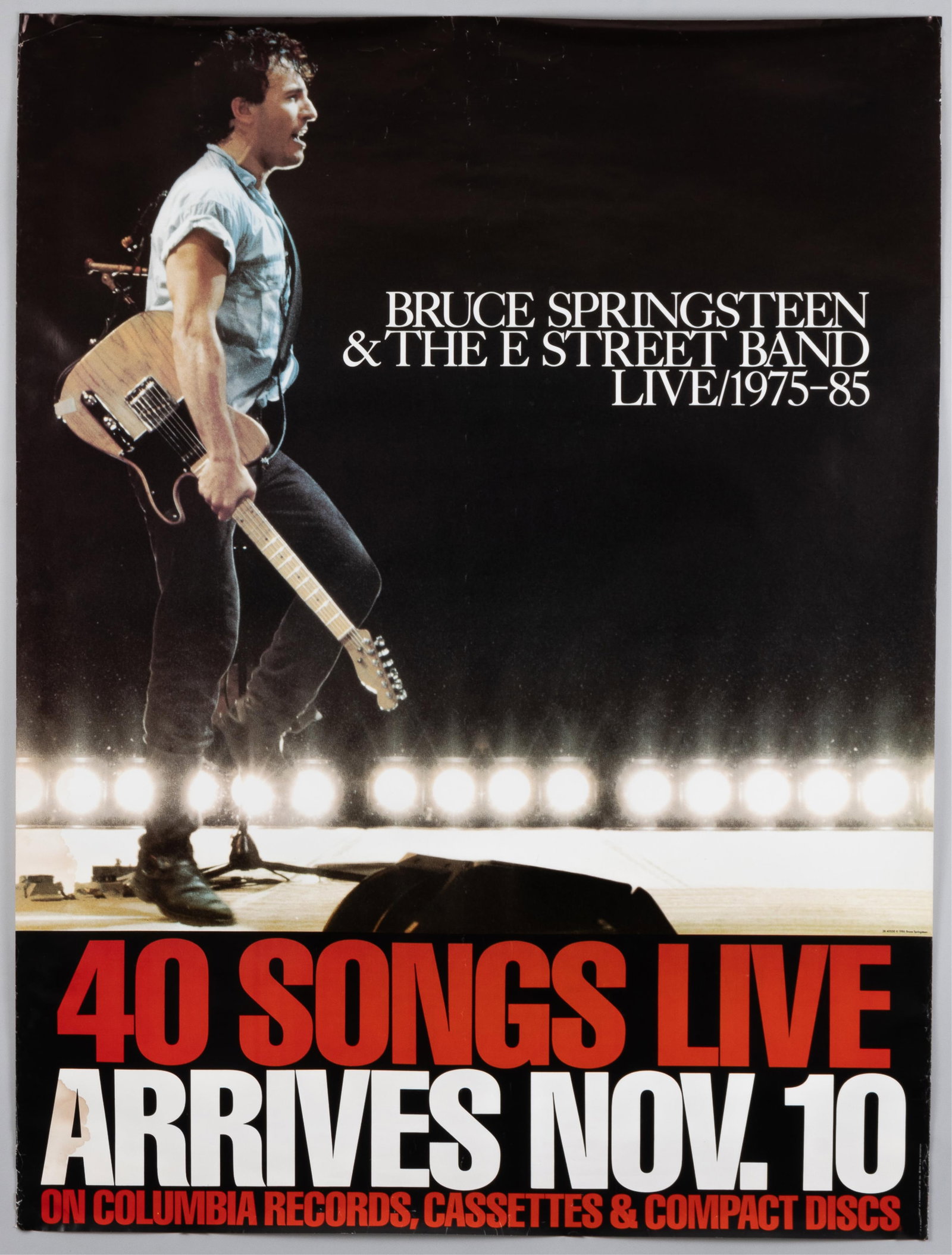 BRUCE SPRINGSTEEN PROMOTIONAL POSTER: Bruce Springsteen and The E Street Band Live 1975-85 promotional poster. Creases and minor tears. Ships rolled. 36.5 x 48 inches.
