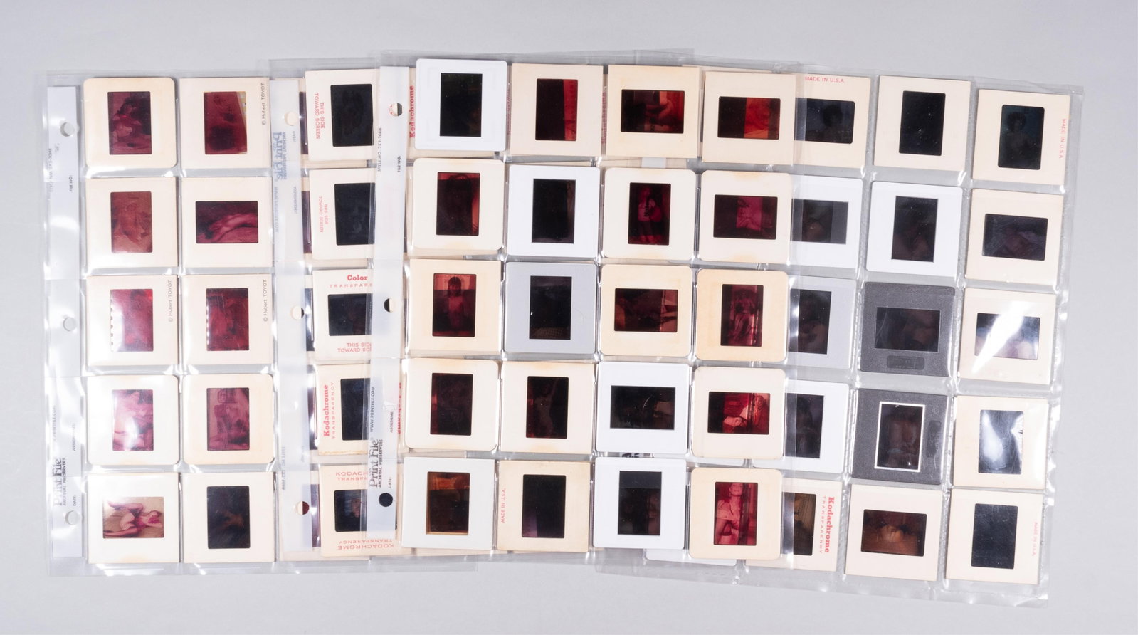 80 EROTIC NUDE COLOR PHOTO SLIDES: 80 explicit X-rated adult nude color photo slides. 1970s-1980s.