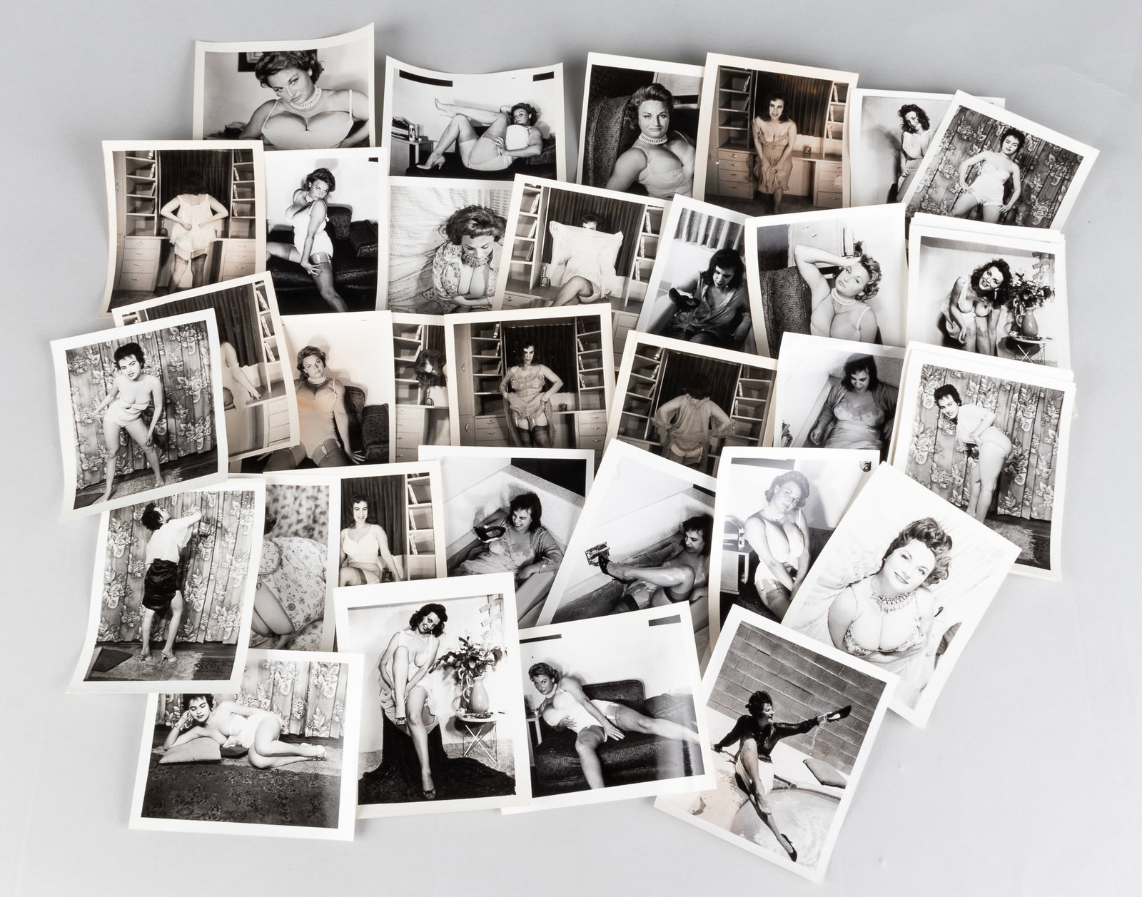 43 VINTAGE EROTIC RISQUE CHEESECAKE PHOTOGRAPHS: 43 vintage b/w erotic risque cheesecake photographs. 4.25 x 5 inches.