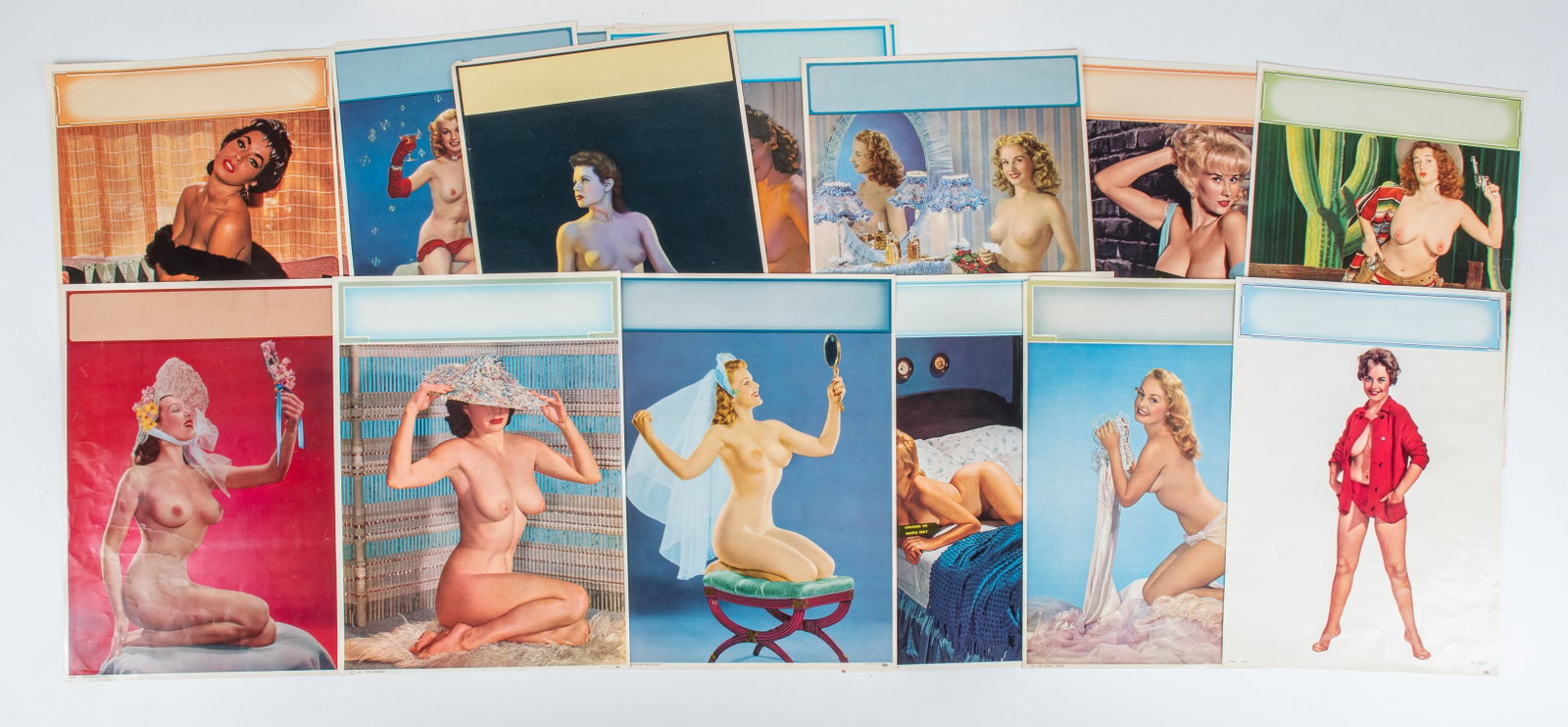 16x VINTAGE 1950s PIN-UP GIRL CALENDAR PRINTS: Sixteen pin-up girl calendar prints, 1950s. Three duplicates, two double-sided prints. 12 x 16.75 inches.
