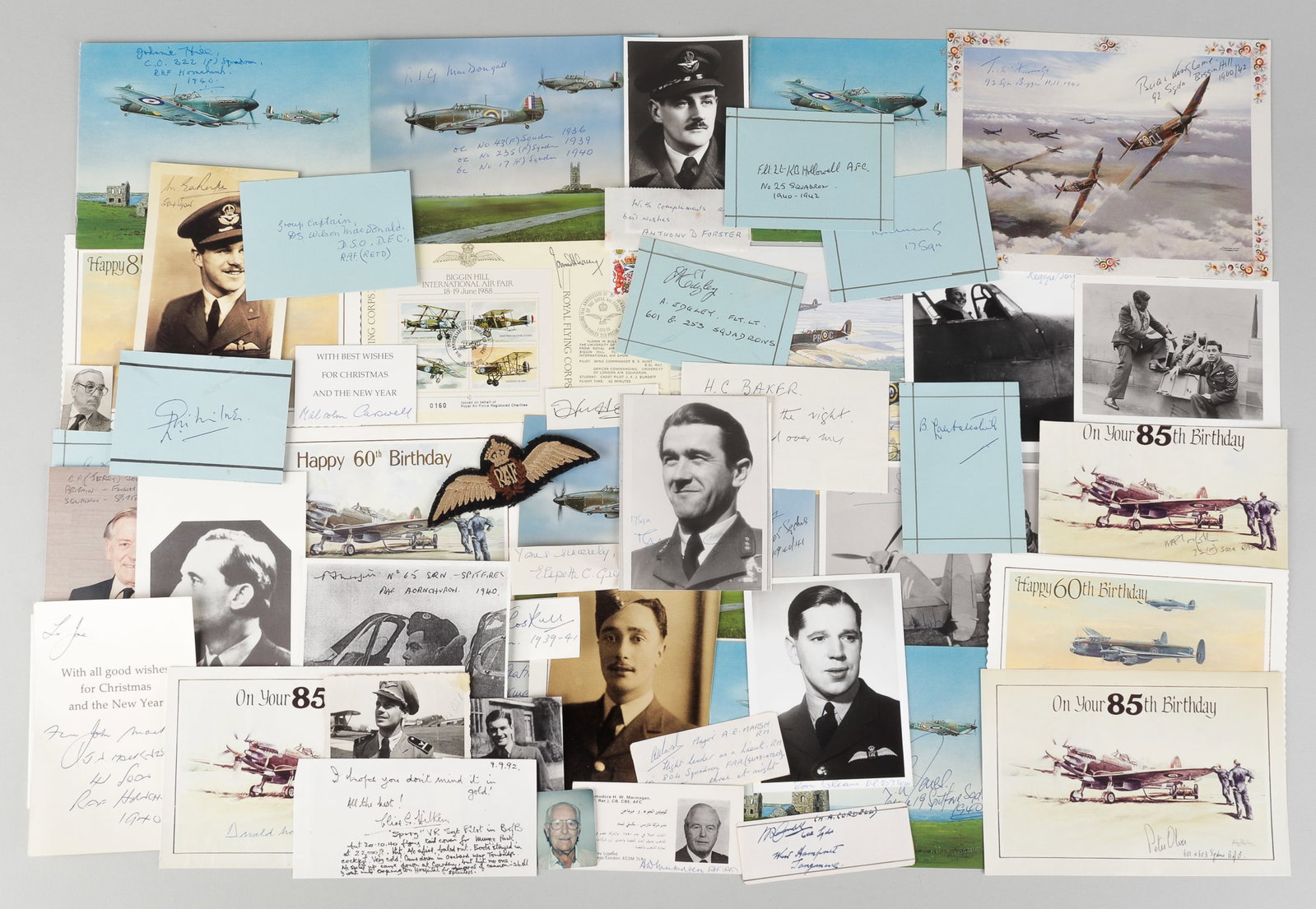 57 WWII BRITISH RAF AUTOGRAPHS: Large collection of fifty-seven British RAF autographs, including some wartime signed photos, some first day covers, and some signed scraps that go with photographs. Also including an RAF pilot wings