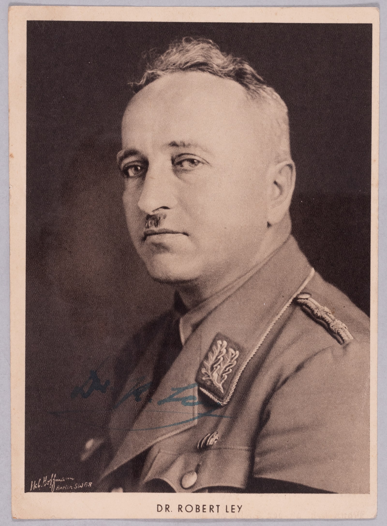 THREE NUREMBERG TRIAL WAR CRIMINALS SIGNED PHOTOGRAPHS: Three Nuremberg War Criminals signed photographs. 1. ROBERT LEY (1890-1945), head of the DAF, whose membership totaled 25 million; Ley was considered the 'dictator of labor' in Germany. Committed