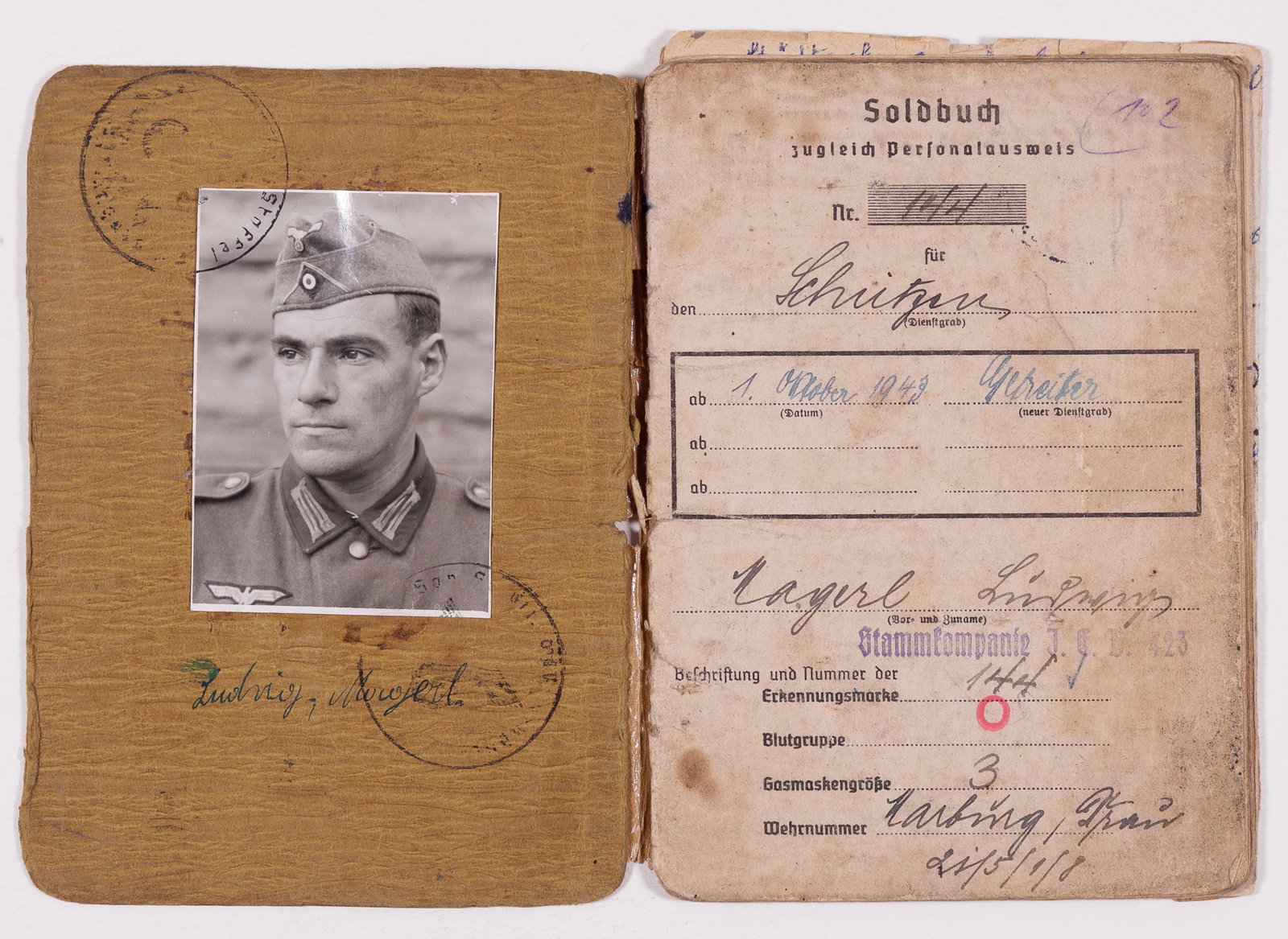 WWII SOLDBUCH SLOVENIA ETHNIC GERMAN: WWII German Soldbuch for a Slovenian ethnic German named Ludwig Magerl, with a b/w photograph pasted on the front of the book; part of Infantry Ersatz Battalion 423; received the Black Wound Badge, th