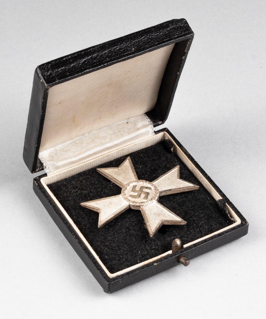CASED WAR MERIT CROSS 1ST CLASS WITHOUT SWORDS KARL GSCHIERMEISTER: WWII German War Merit Cross without swords, 1st Class with its original case, c-clasp pin back design, marked '50' for 'Karl Schiermeister of Vienna' on the pin. Approx. 48 x 48 mm.