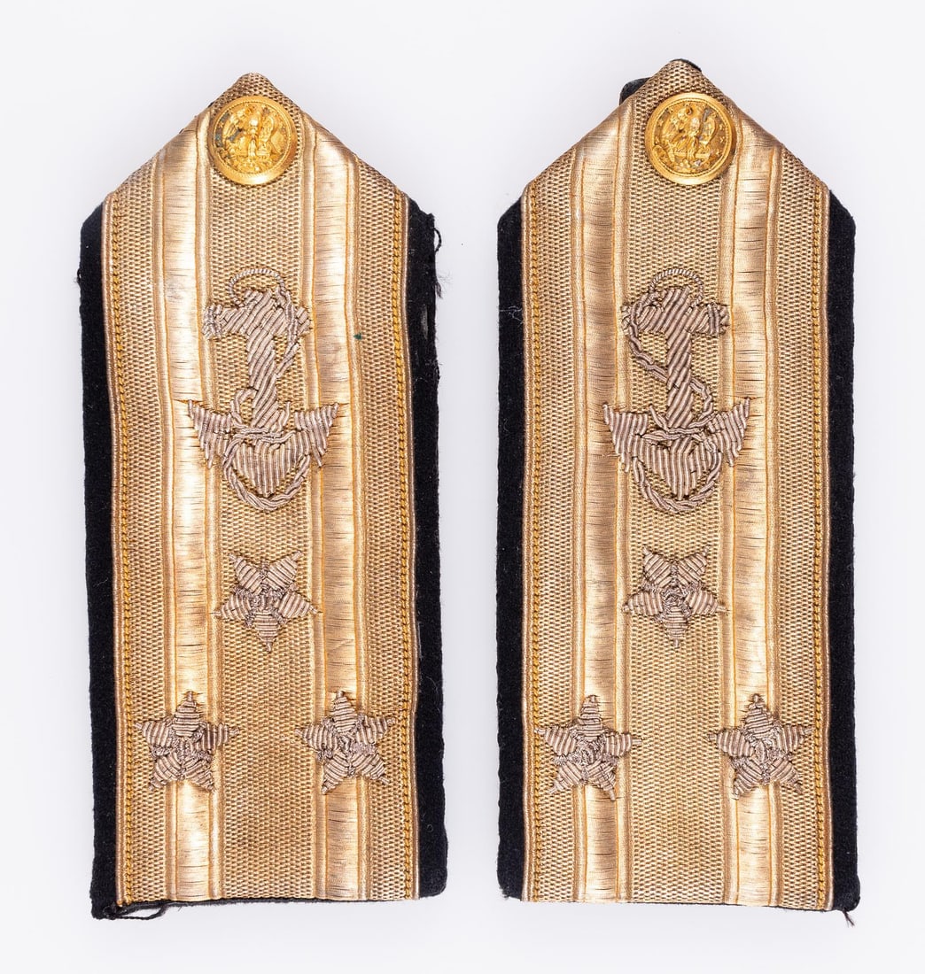 WWII VICE ADMIRAL SHOULDER BOARDS: WWII Vice Admiral shoulder boards, each featuring three silver bullion stars, a fouled anchor, and a USN button at the top. The reverse has a leather attachment strap, missing its button, with the att