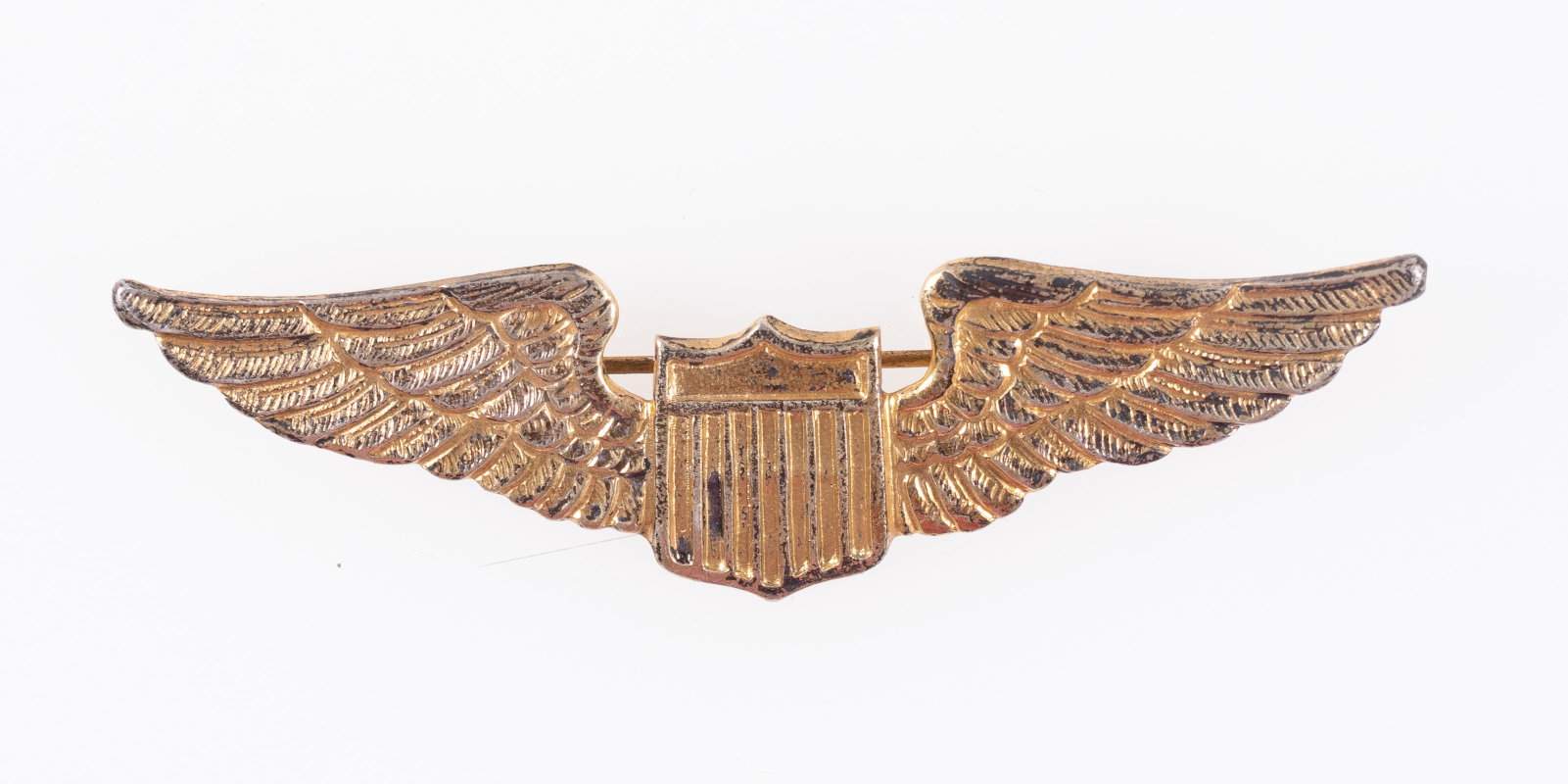 WWII USAAF PILOT WINGS GOLD: WWII US Army Air Force pilot wings, straight pin C-clasp pin back. Gold wash, marked 'Sterling' on the back. 3 inches long. From the personal collection of Art Beltrone.