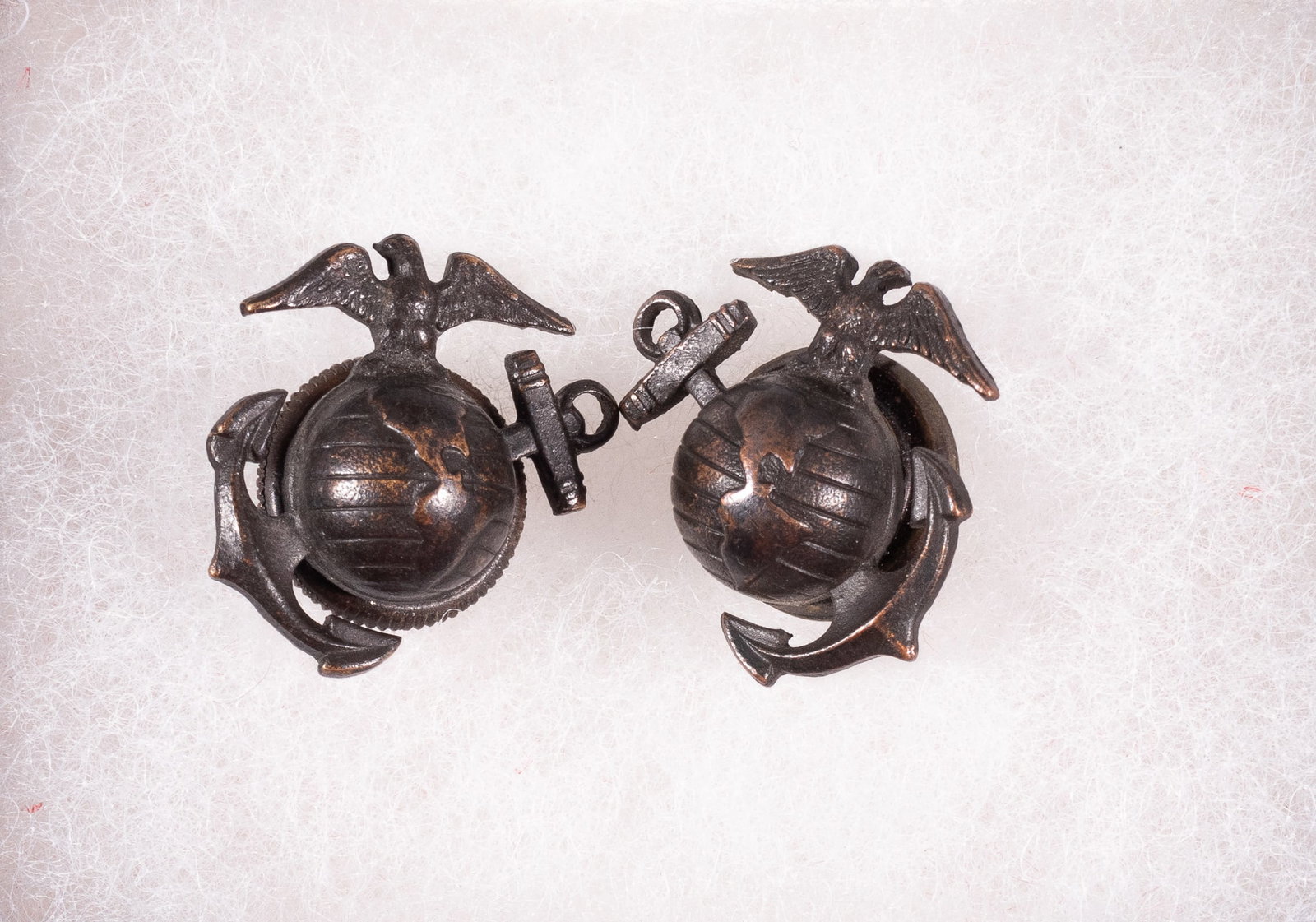 EARLY 1900S MARINE CORPS COLLAR INSIGNIA PINS: Early 1900s Marine Corps collar insignia pins. Pair of reversed collar pins featuring a fatter eagle (consistent with pins from the China Relief Expedition) over the earth with a fouled anchor in the 