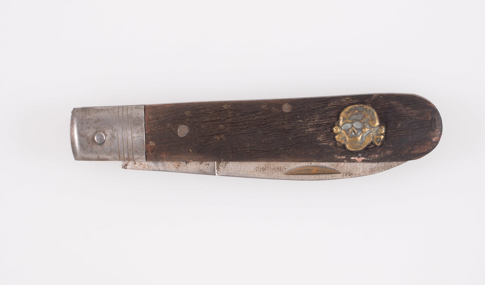TOTENKOPF POCKET KNIFE: Totenkopf pocket knife, blade is marked 'PUMA - SOLINGEN' and 'RZM M7/27'. 3.5-inch long blade, wood grips with gold colored Totenkopf insignia on one end of the grip.