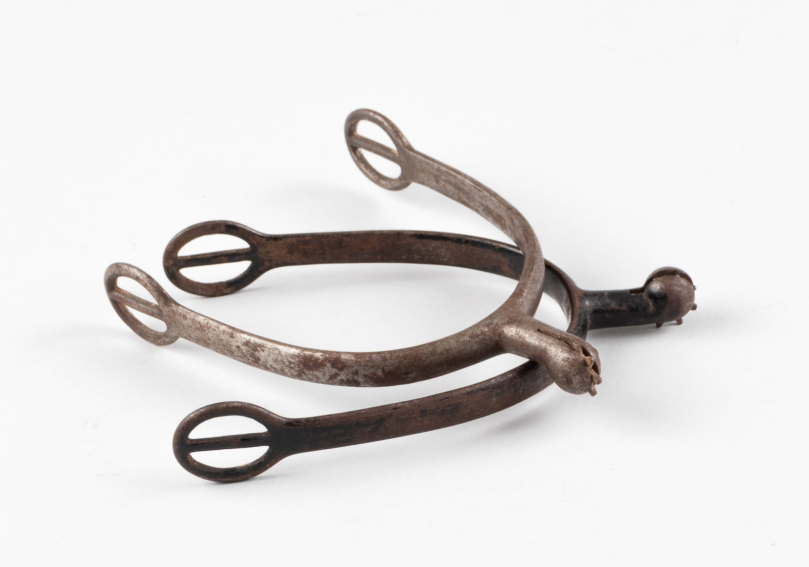 MODEL 1885 SPURS USED IN THE MEXICAN EXPEDITION: WWI German Cavalrymen steel spurs with small rowels, one black spur, marked on the inside 'Geschmiedet,' and one silver spur, marked on the inside 'Geschmiedet,' with a maker's mark with the initials 