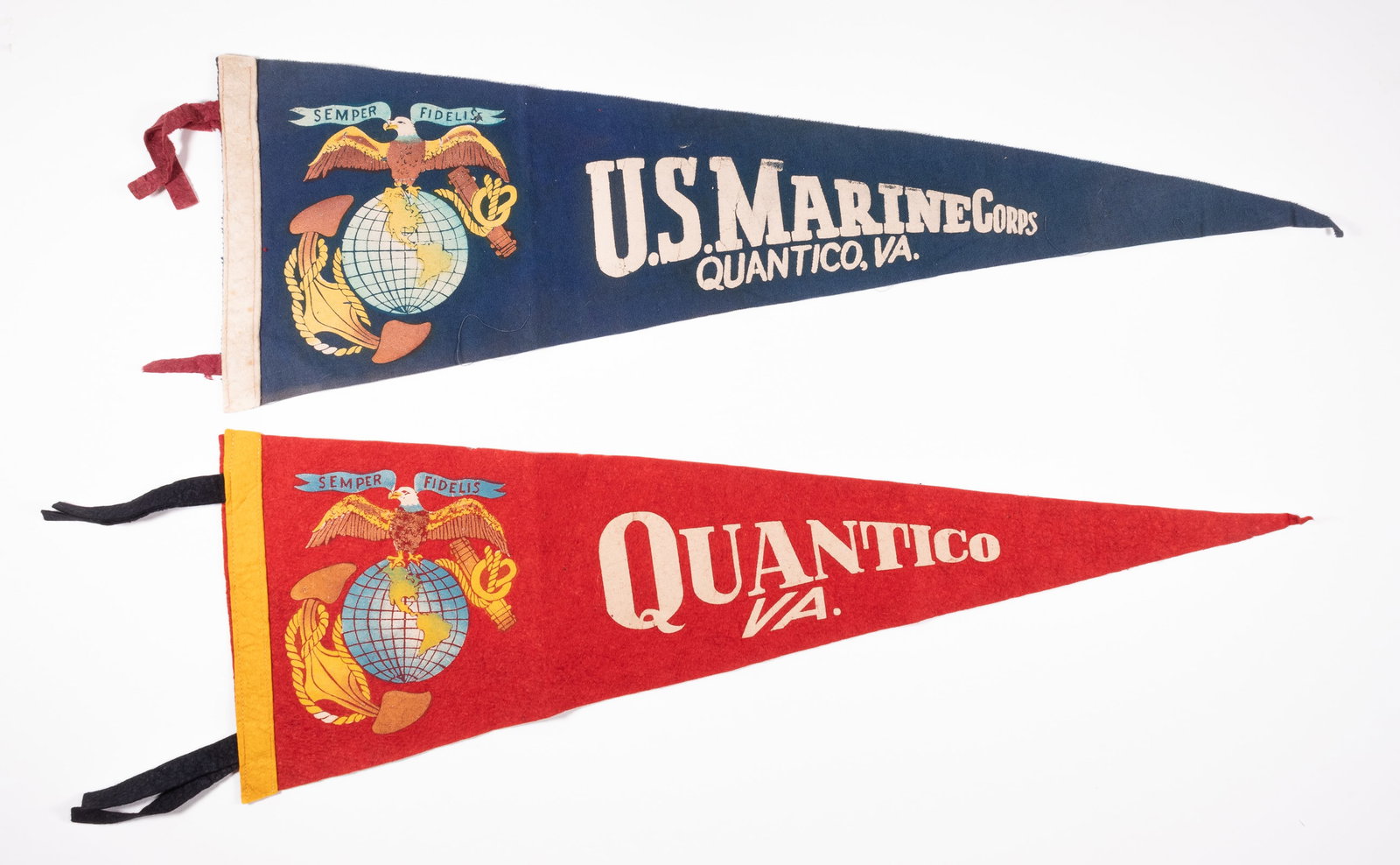 2 VINTAGE USMC U.S. MARINE CORPS QUANTICO PENNANTS: Pair of vintage U.S. Marine Corps Quantico felt pennants. 8.25 inches tall at hoist, 26 inches long. From the personal collection of Art Beltrone.