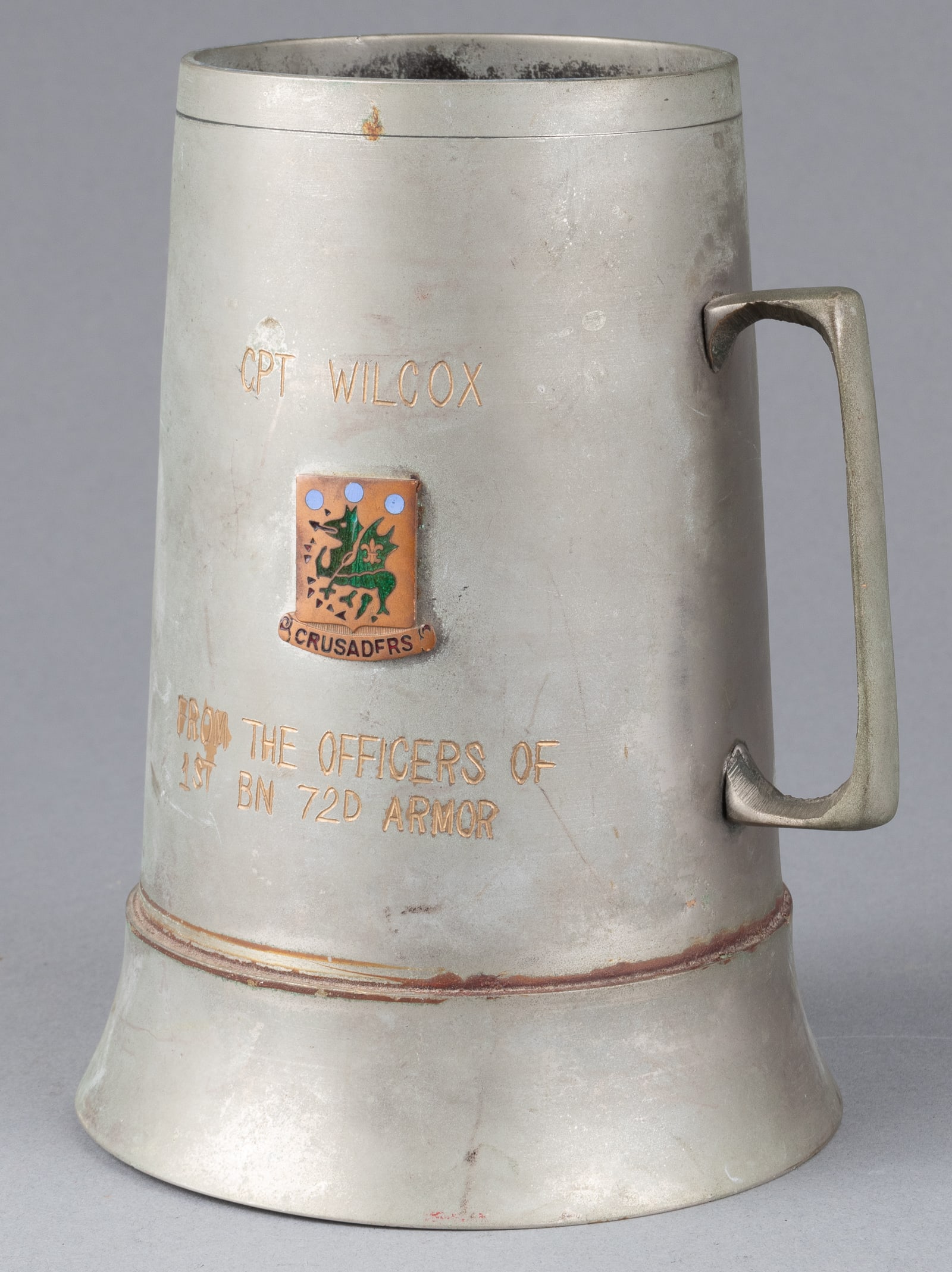 KOREAN WAR ERA NAMED US DRINKING TANKARD: Korean War era named pewter US drinking tankard, ca. 1952, one side reads 'Cpt. Wilcox, From The Officers of 1st Bn 72D Armor,' with thirty-eight names marked on the reverse from the presenters, all