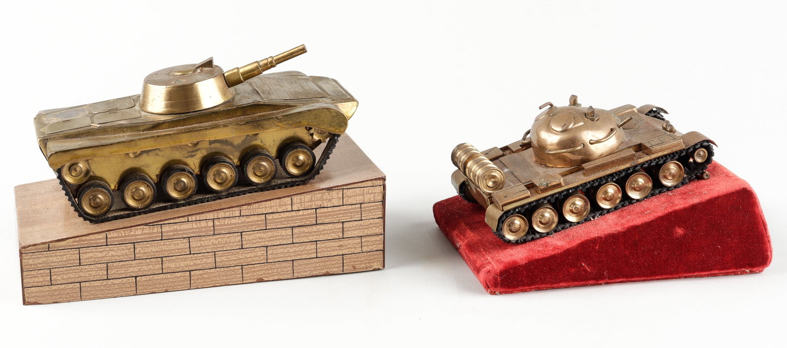 2 SOVIET TANK DESK STATUES: Two Soviet tank desk statues, including one of a T-55 tank, mounted to a red velvet base with a plaque in the front that reads 'To Naryzhny H.O. on the day of the 60th Anniversary of the trust's