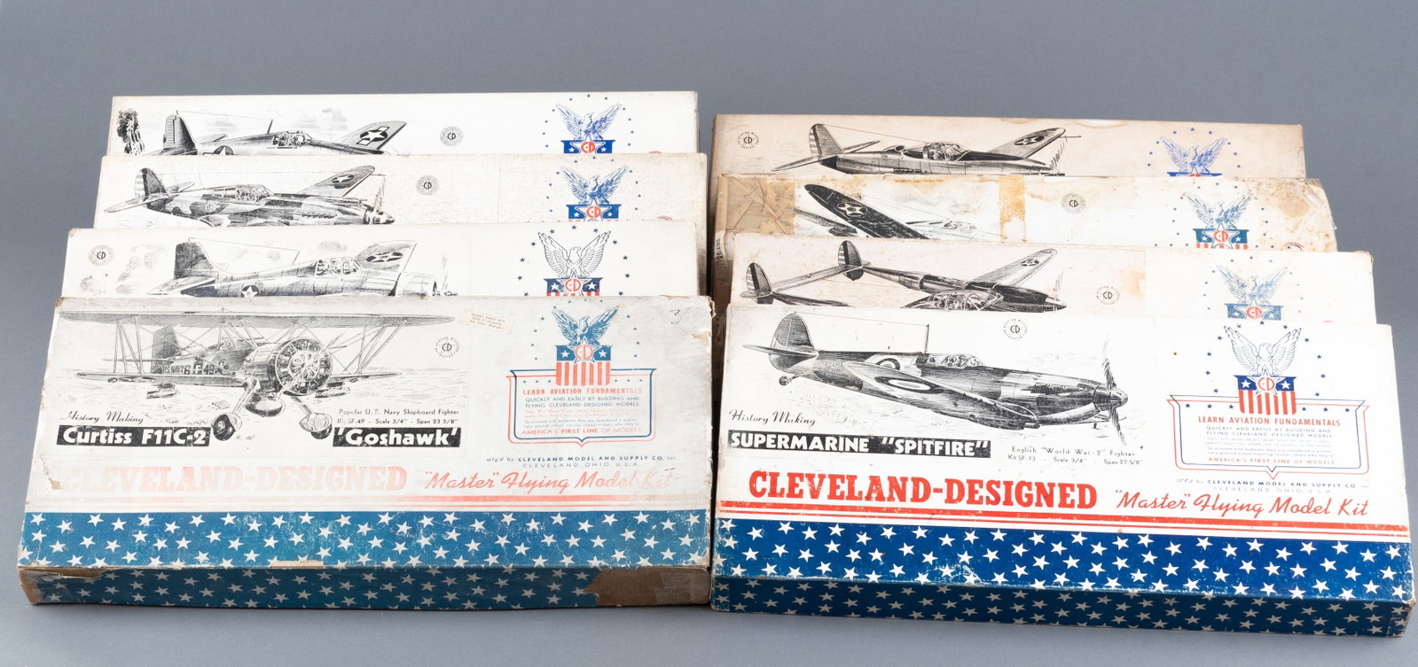8 CLEVELAND'S MASTER FLYING MODEL KITS: Eight vintage Master Flying model kits, including kits for the Curtiss P-40 Tomahawk, Bell Airacobra, P-47 Thunderbolt with torn box, the Supermarine Spitfire, the Lockheed P-38 Lightning, the Grumman