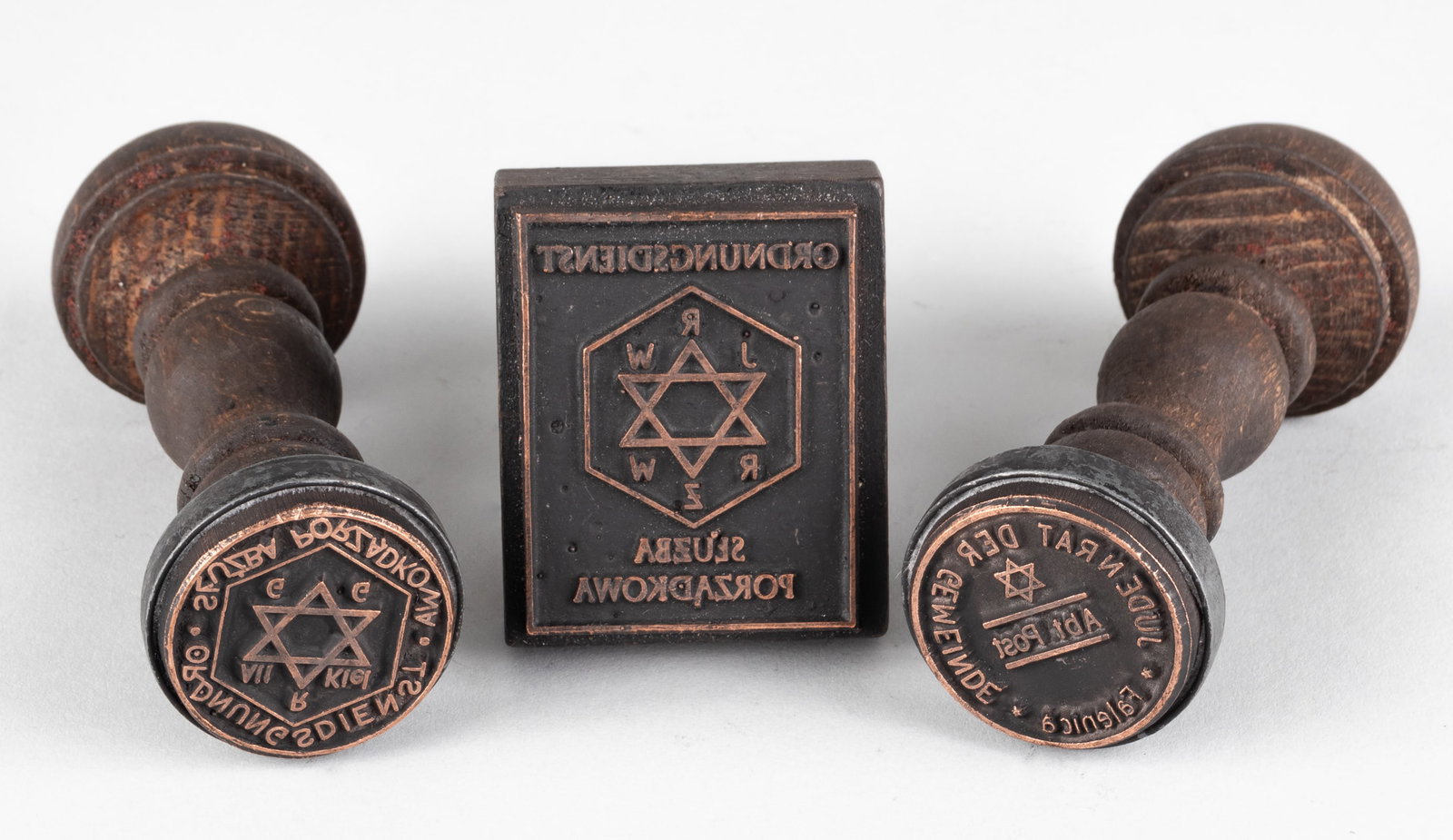 THREE GERMAN JEWISH GHETTO HANDSTAMPS: Three Jewish Ghetto handstamps, ‘Judenrat Post Der Gemeinde Falenica,’ ‘Sluzba porzadkowa Ordnungsdienst,’ and a square stamp ‘Ordnungsdienst Sluzba porzadakawa.’