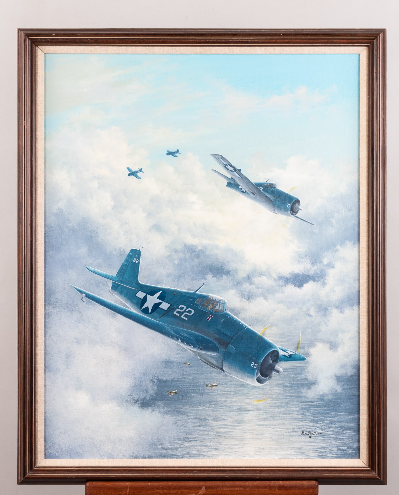 GRUMMAN F6F HELLCAT OIL PAINTING BY ROBERT A. BENJAMIN: Original oil painting on canvas by aviation artist Robert A. Benjamin, titled 'Rising to the Challenge,' depicting four Grumman F6F Hellcat fighter planes. Signed and dated 1985 on the reverse by arti