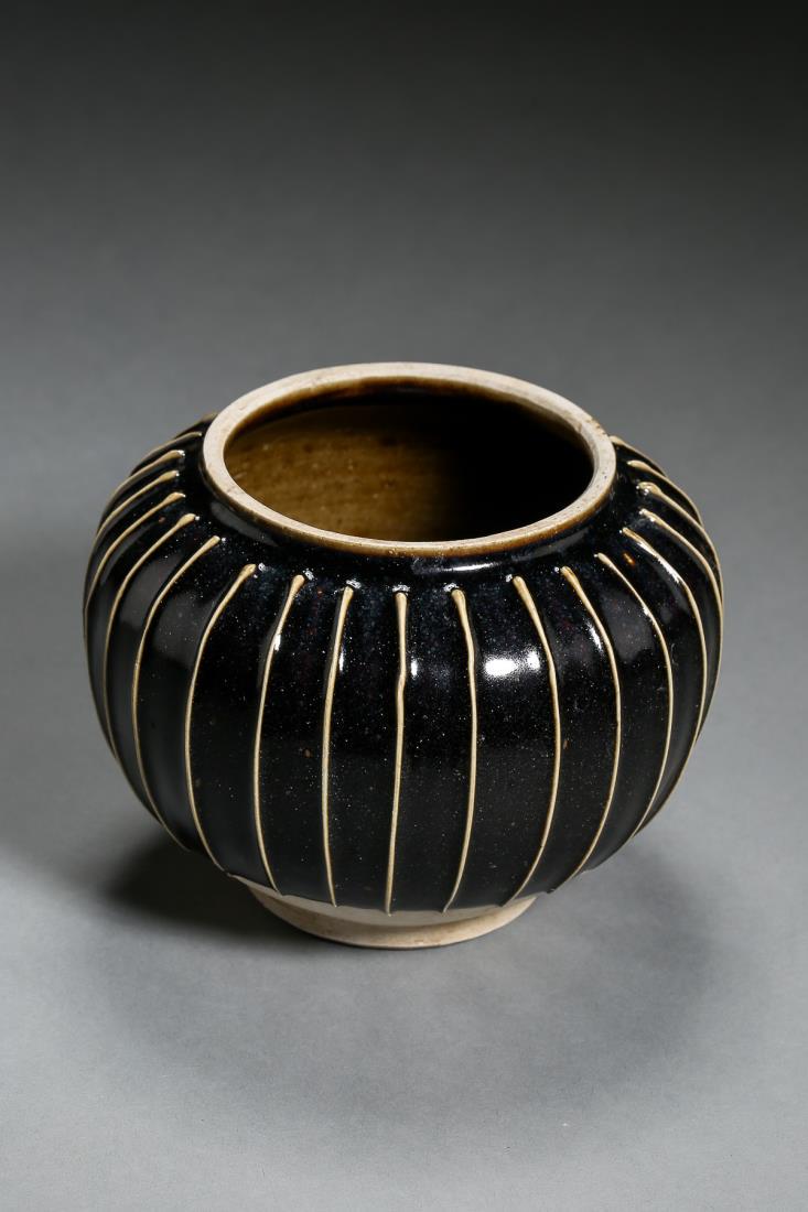 A BLACK GLAZED WHITE STRIPED JAR (1 of 11)