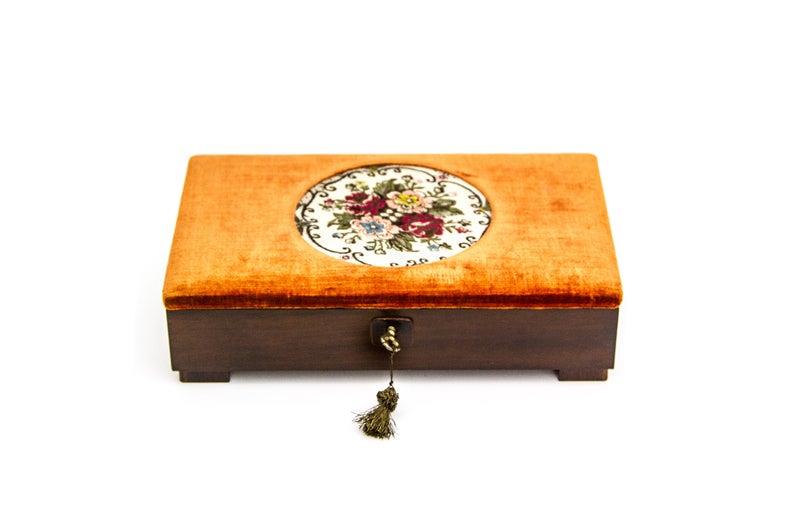 ITALIAN NEEDLEPOINT AND VELVET JEWELRY LOCK BOX: Italian needlepoint and velvet jewelry lock box, vintage from the 1930s.Dimension: L 26.0 cm W 16.5 cm H 7.0 cmAll measurements are approximate.To view additional photos, please visit the following li