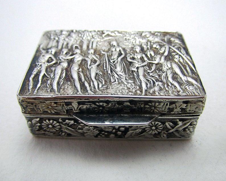 ITALIAN STERLING SILVER HALLMARKED BOX: Late 19th-century (1893) sterling silver napkin ring. Dimension: H 1.4 cm W 4cm D 2.5 cm All measurements are approximate.