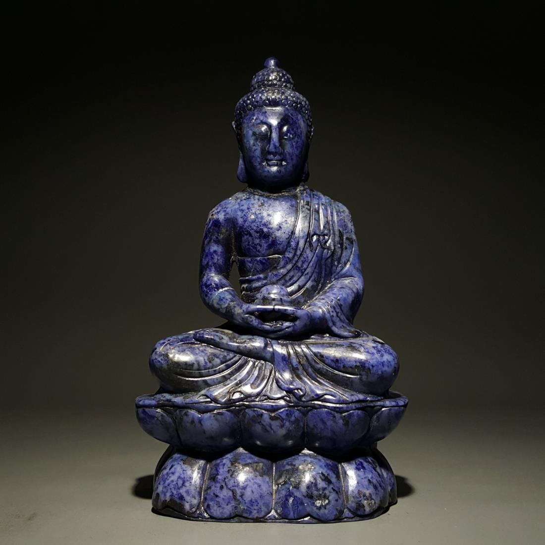 A LAPIS LAZULI CARVING OF SHAKYAMUNI: A lapis lazuli carving of Shakyamuni. Dimension: H 20.5 cm, W 12 cm, D 5 cm. Weight: 1219 g All measurements are approximate.