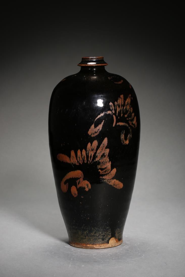 A YUAN CIZHOU WARE BLACK-GLAZED MEIPING VASE: A yuan cizhou ware black-glazed meiping vase, Chinese Yuan Dynasty Period, depicted with copper red floral design in black glazed background, the base is left un-glazed. Dimension: H 27.5 cm, Diam 14 
