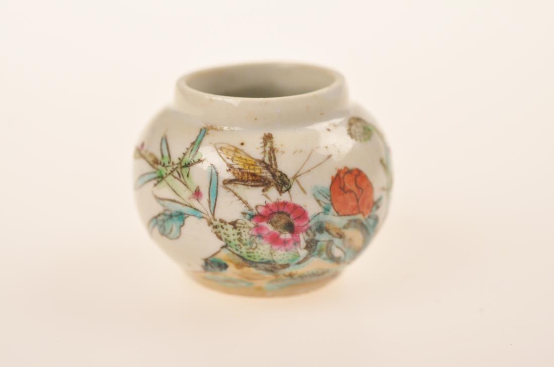A FAMILLE ROSE 'FLOWER AND INSECT' WATER POT: A famille rose 'flower and insect' water pot, probably made in the Republic of China period. Dimension: H 4 cm, Diam 5 cm. All measurements are approximate.