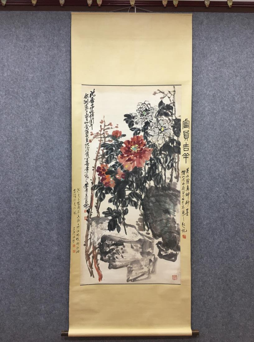 A CHINESE PAINTING OF FLOWER & ROCK, WU CHANGSHUO: A Chinese painting of flower and rock by Wu Changshuo. Ink and color on paper, Hanging scroll. Dimension: Inner Painting: 135 cm x 67 cm. All measurements are approximate.