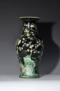 A BLACK-GROUND WUCAI 'MAGPIE ON PLUM' VASE