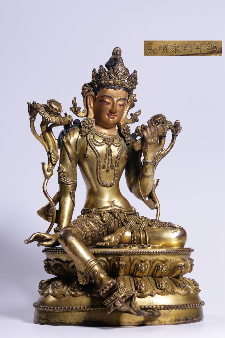 A GILT BRONZE SEATED TARA BUDDHA (1 of 9)