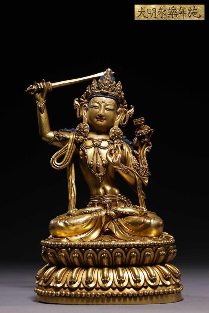 A GILT BRONZE FIGURE OF MANJUSHRI BUDDHA (1 of 9)