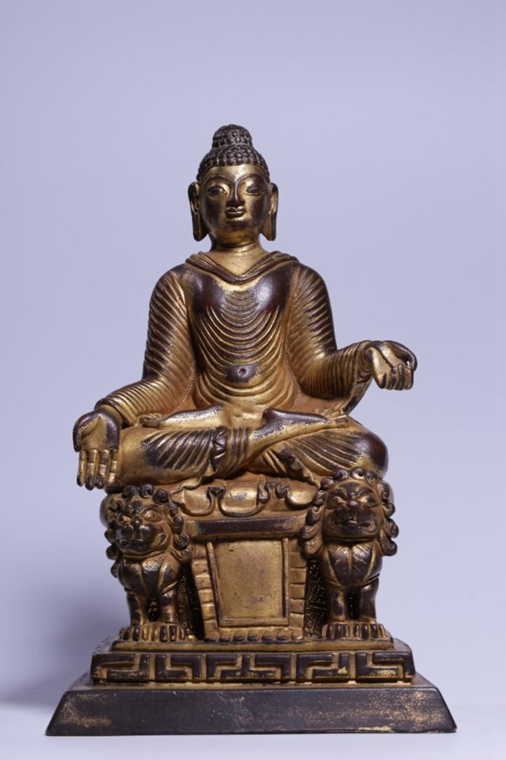 A GILT BRONZE SEATED FIGURE OF  SHAKYAMUNI BUDDHA (1 of 9)