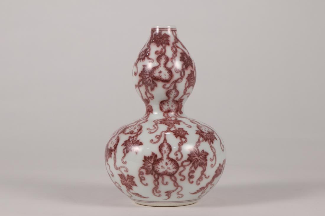 A COPPER RED PORCELAIN GOURD VASE (1 of 9)