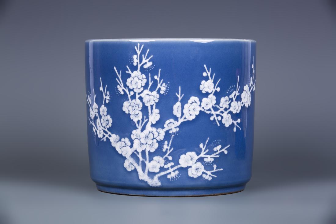 BLUE AND WHITE 'PLUM BLOSSOM' BRUSH POT: Blue and white 'plum blossom' brush pot. Dimensions: H 18.5 cm, Diam 21 cm. All measurements are approximate.