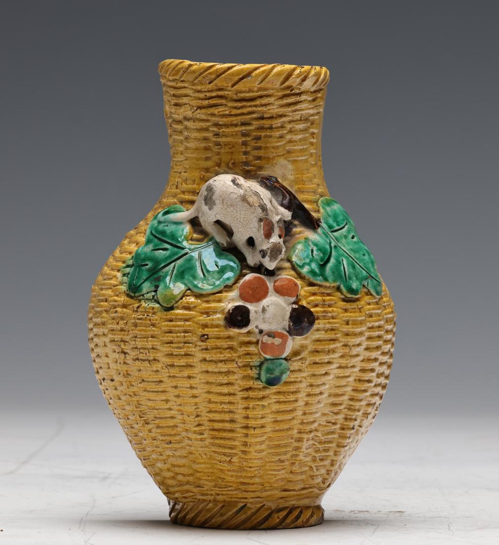 LATE QING, AN IMITATION BAMBOO GRAIN WALL VASE: Late Qing, an imitation bamboo grain wall vase.Dimensions: H 19cm.All measurements are approximate. Click here for high resolution images 點