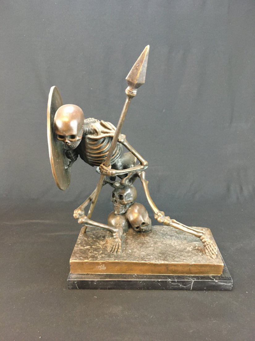 BRONZE WARRIOR SKELETON STATUE MILO: BRONZE WARRIOR SKELETON STATUE. SIGNED MILO. REMINISCENT OF "JASON AND THE ARGONAUTS",WITH REMOVABLE BRONZE SPEAR. STATUES SITS ON A BLACK STONE BASE AND WEIGHS IN TOTAL 10.5 LBS. IT MEASURES 9 1/2" H