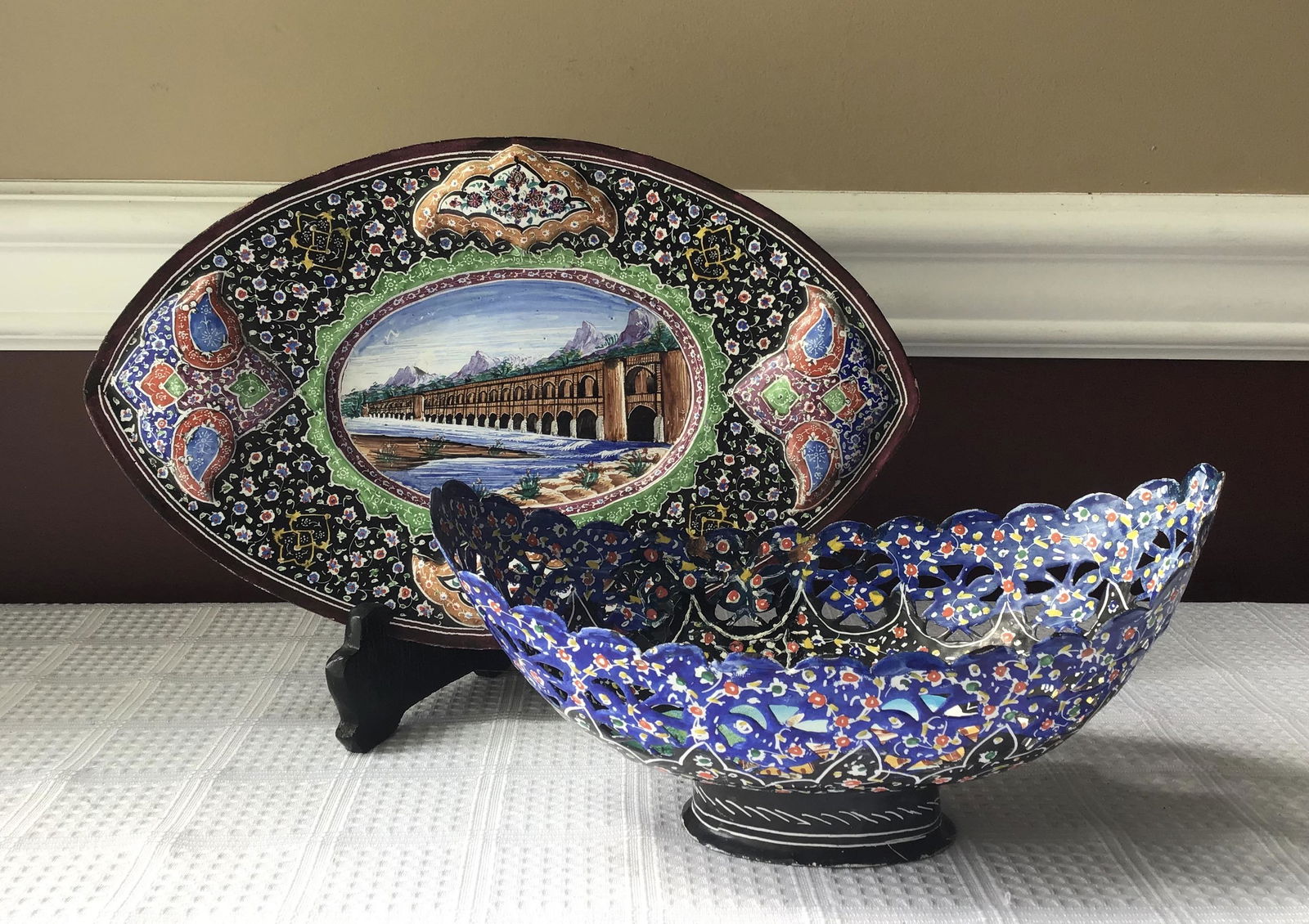 Lot of 2 Hand Painted Vintage Persian Bowl & Plate: Lot of 2 Hand Painted Enameled Vintage Persian Metal Bowl and Plate from Isfahan. Size: The footed plate is approximately 11 1/2 x 7 1/4 x 1 1/4 inches. The footed bowl is approximately 8 7/8 x 5 x 4