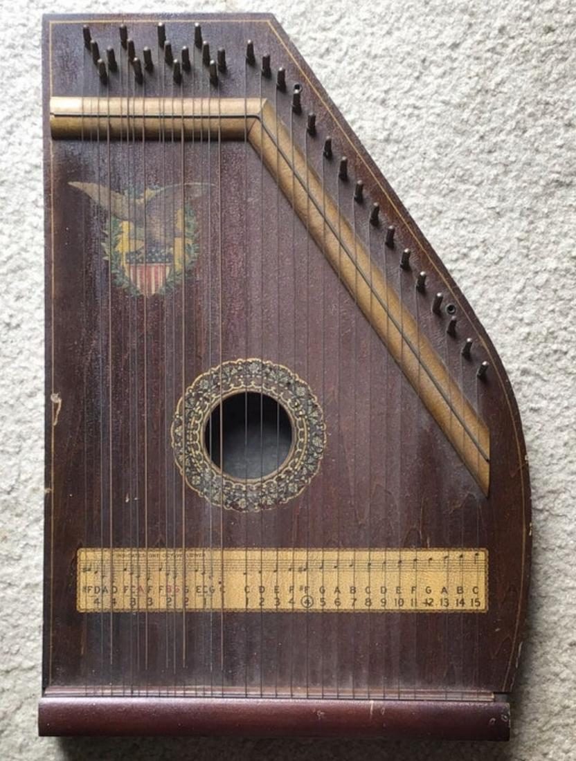 Antique Chartola Grand Zither, Marxophone, W. US Emblem: Antique Chartola Grand Zither, Marxophone Musical Stringed Instrument with US Emblem. Size: Approximately 19 x 13 inches.