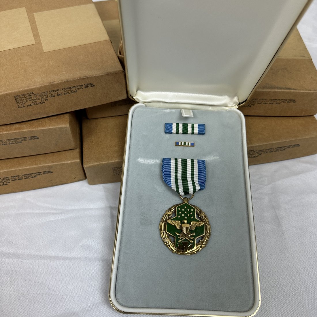 Lot of 8 US Joint Service Commendation Medals: Lot of 8 vintage US joint service commendation medals. All boxed.