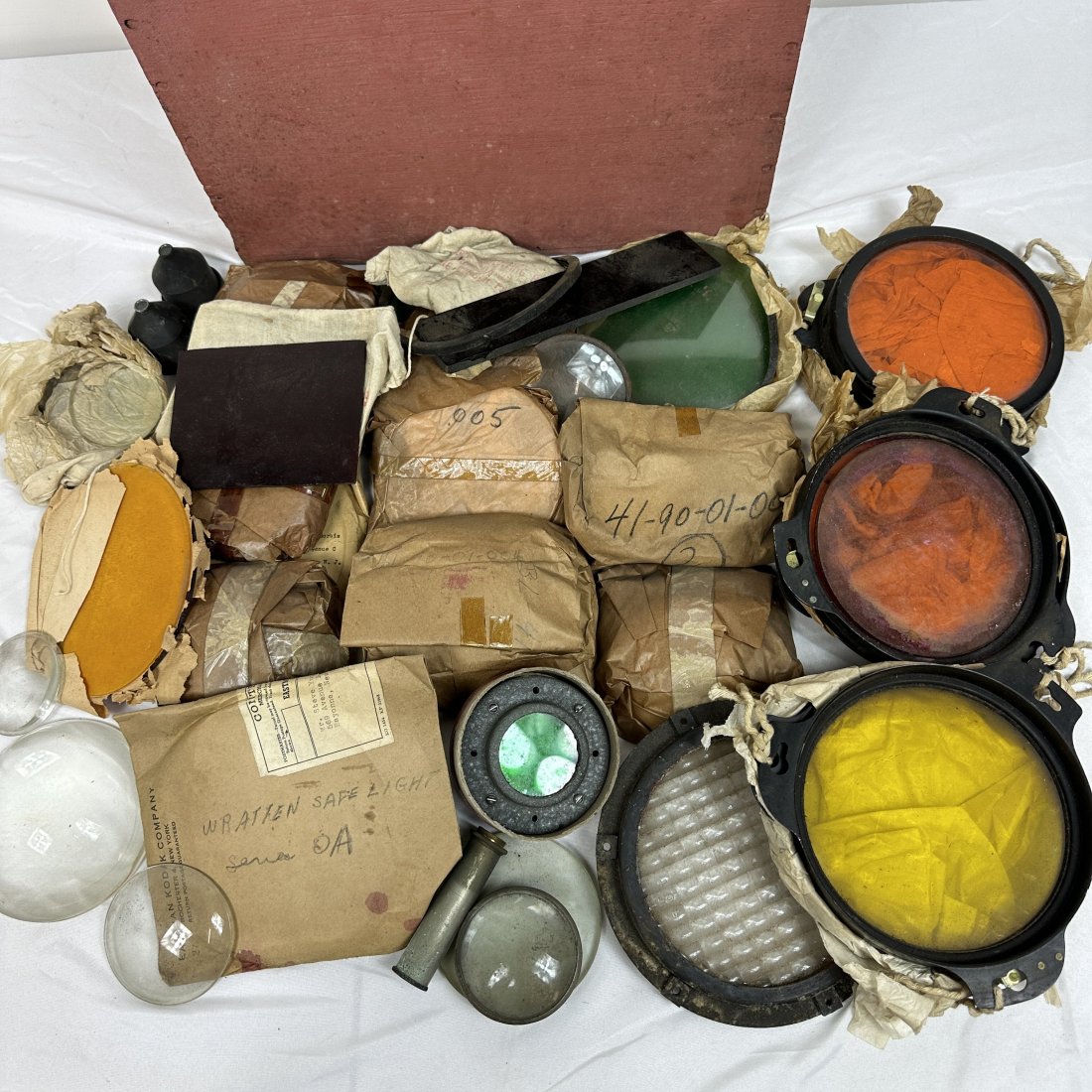 Military Glass Lens & Color Filter Optics Replacement Parts Lot: Lot of vintage surplus US military glass lens and filter optics replacement parts. In painted wood Peters shotgun shell box.