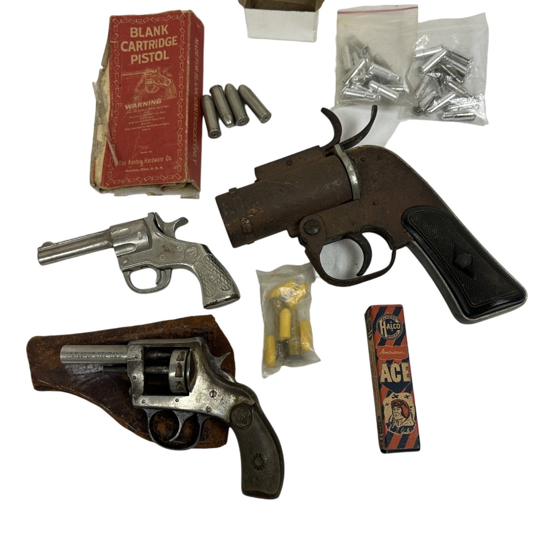 Vintage Flare Pistol Blank Gun & Cap Gun Accs. Lot Kenton Hardware Cast Iron H&R: Vintage lot of blank pistols, inert cap gun cartridges, and flare pistol. Kenton Hardware cast iron blank gun. H&R blank pistol.