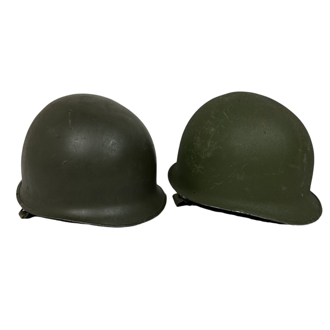 2 Front Seam US M1 Helmet Lot: Lot of 2 vintage front seam US M1 helmets. Capac and Westinghouse liners. Large crack in one liner.