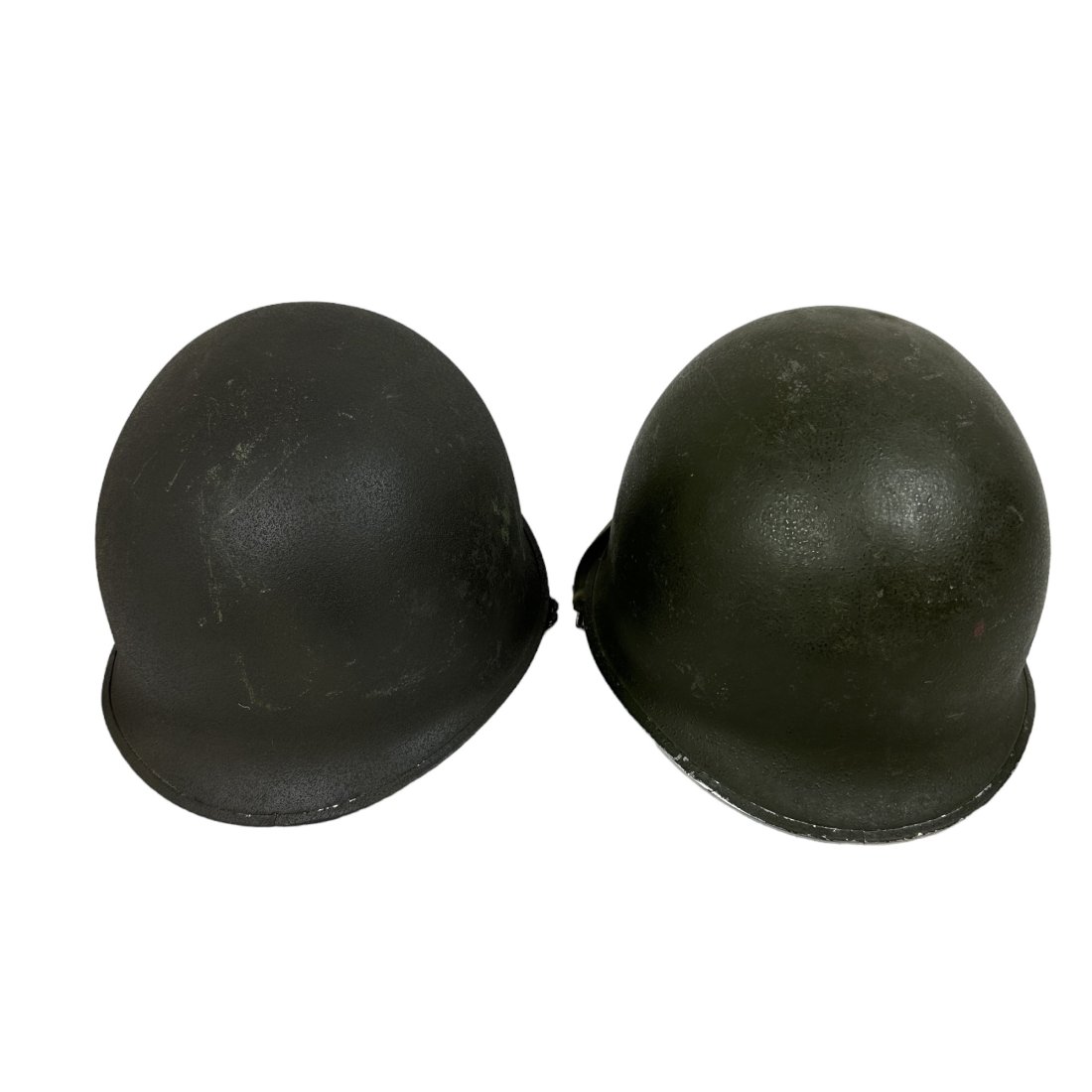 2 US Front Seam M1 Helmet Lot - Capac & Seaman Liners: Lot of 2 US front seam M1 helmets. Capac and Seaman liners.