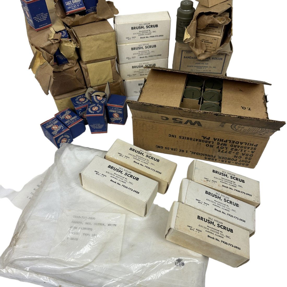 US Military Surplus Gauze Foot Powder Scrub Brush Hospital Sheets Medical Lot: Lot of vintage US military surplus medicals supplies. Includes case of foot powder, hospital bed sheets, scrub brushes, and assorted gauze bandages.