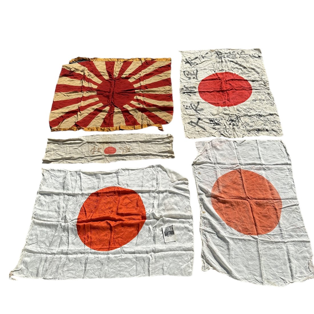 WWII Japanese Battle Flag Meatball Headband Lot w/ Photo: Lot of 5 WWII era Japanese flags. Smallest narrow piece appears to be a headband. Includes photo of US soldiers holding a Japanese flag that was found with lot. Largest flag measures 36” x 26&rd